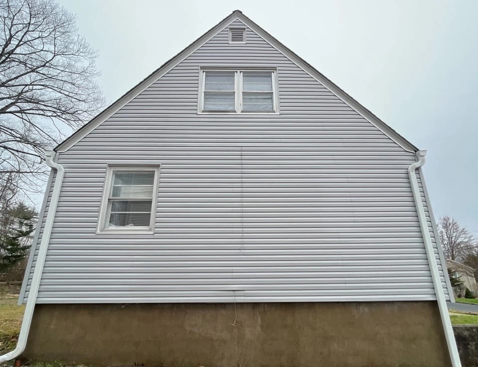 Strongsville Power Washing technician performing detailed house washing in Strongsville residential area