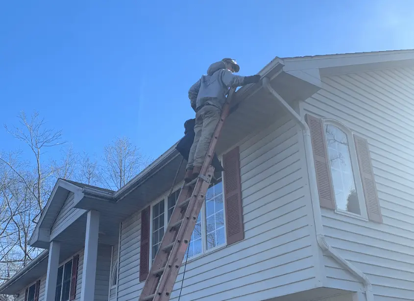 Gutter cleaning and maintenance being performed by Strongsville Power Washing in Strongsville